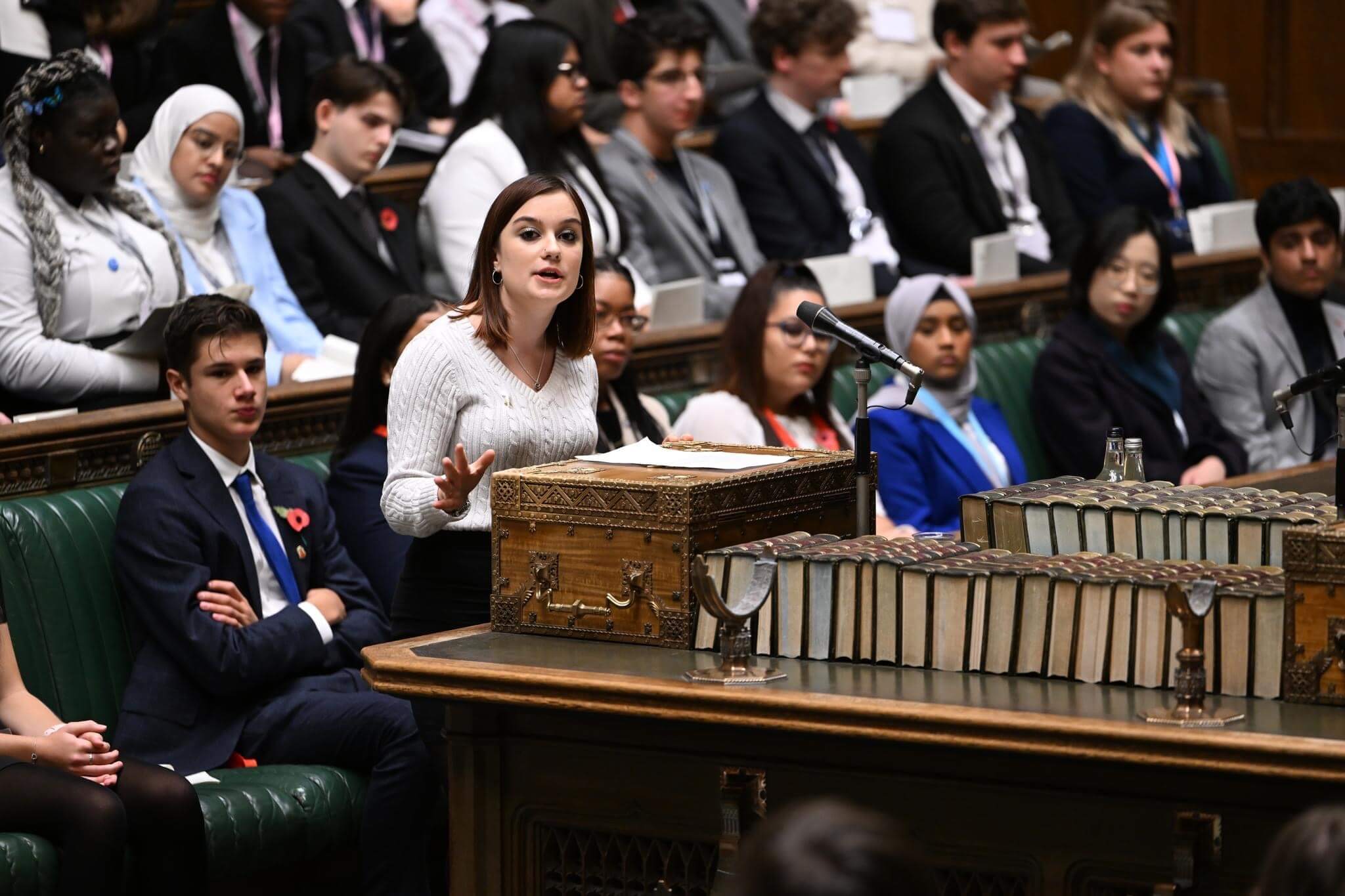 a teenager leads a debate in parliament
