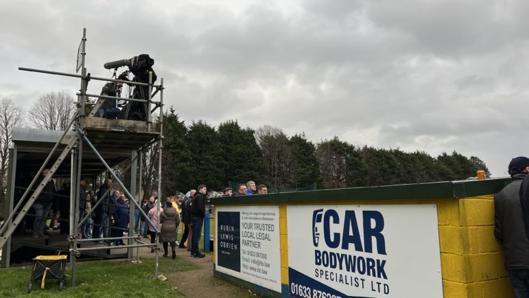 a tv camera at a football match