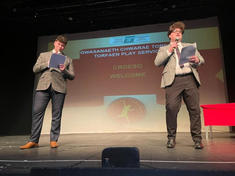 two young men on stage compere an awards evening