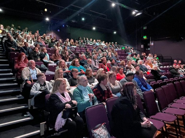 an audience in a theatre