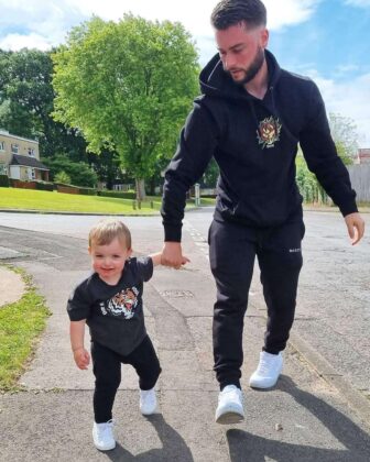 dad and son walk hand in hand