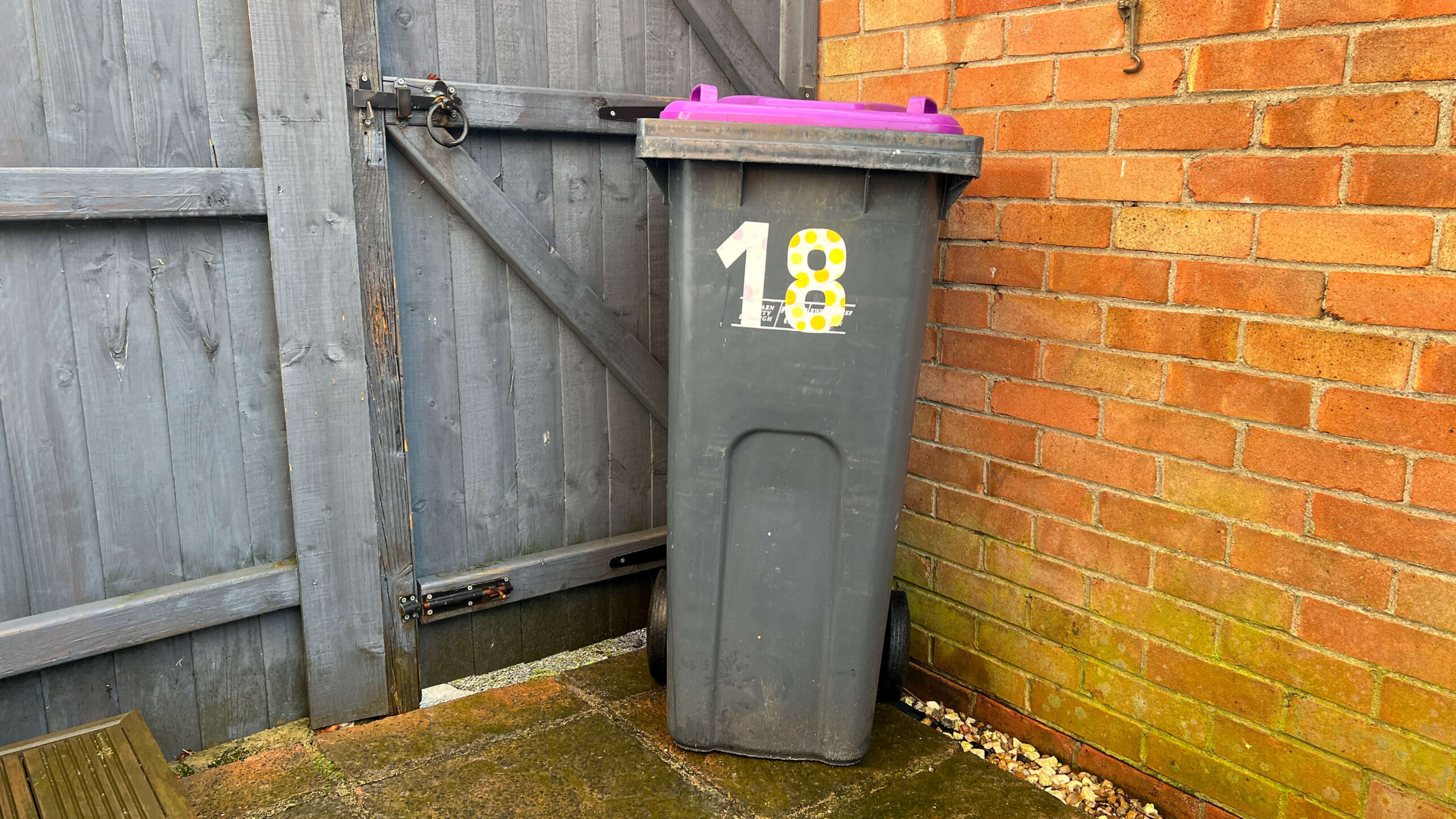 a purple lidded bin