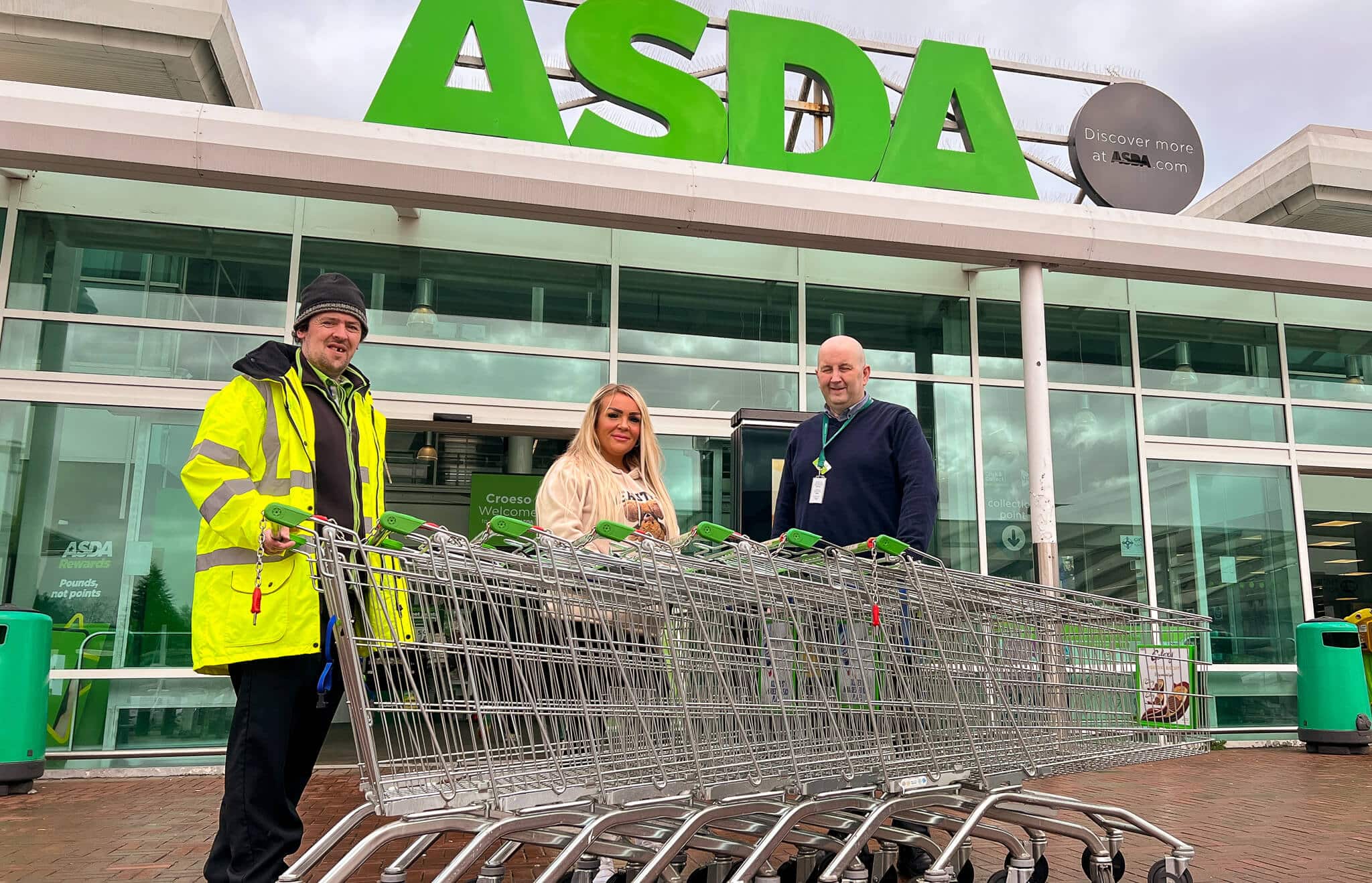 staff stood by trolleys outside Asda