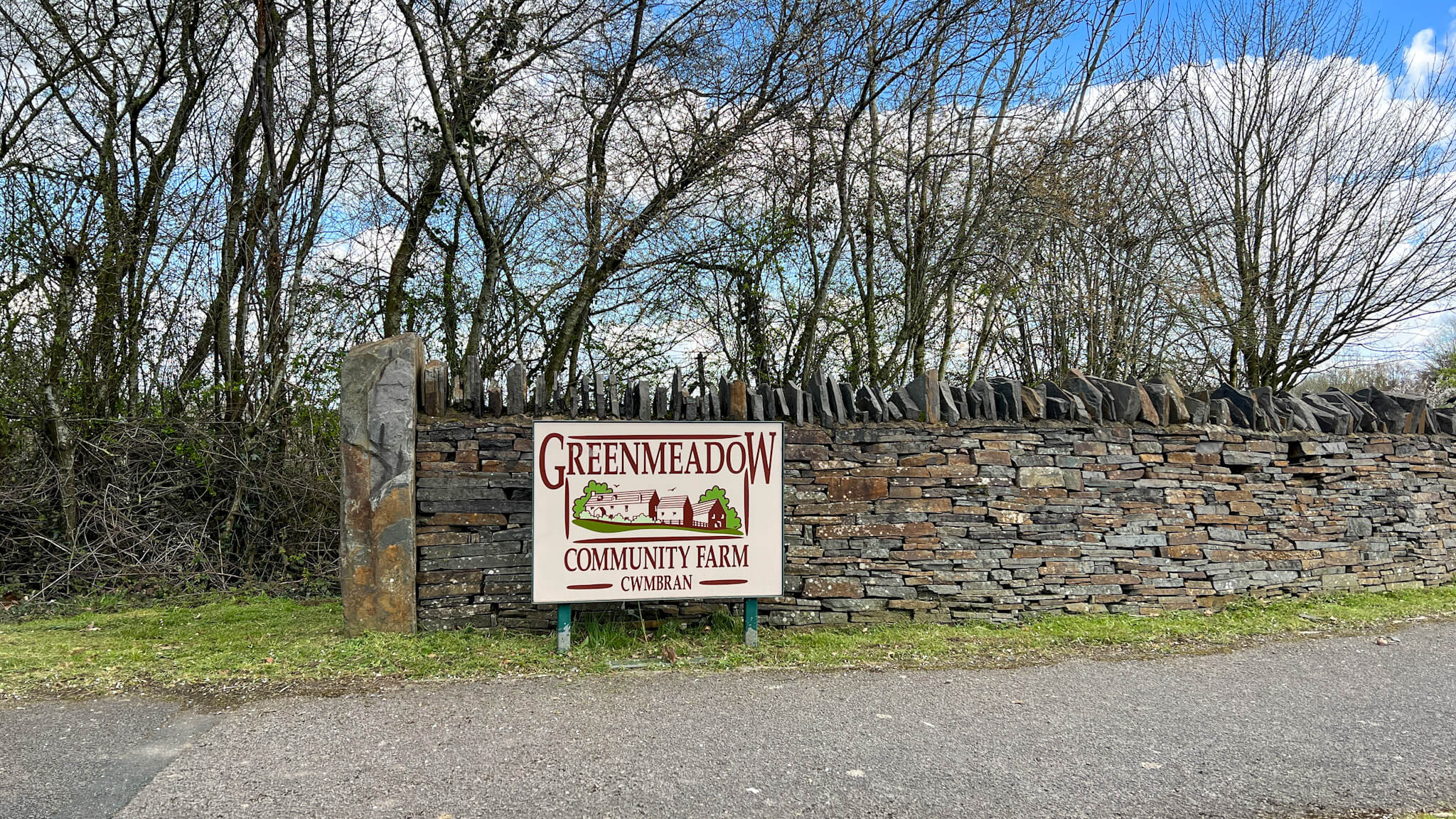 entrance sign to a farm