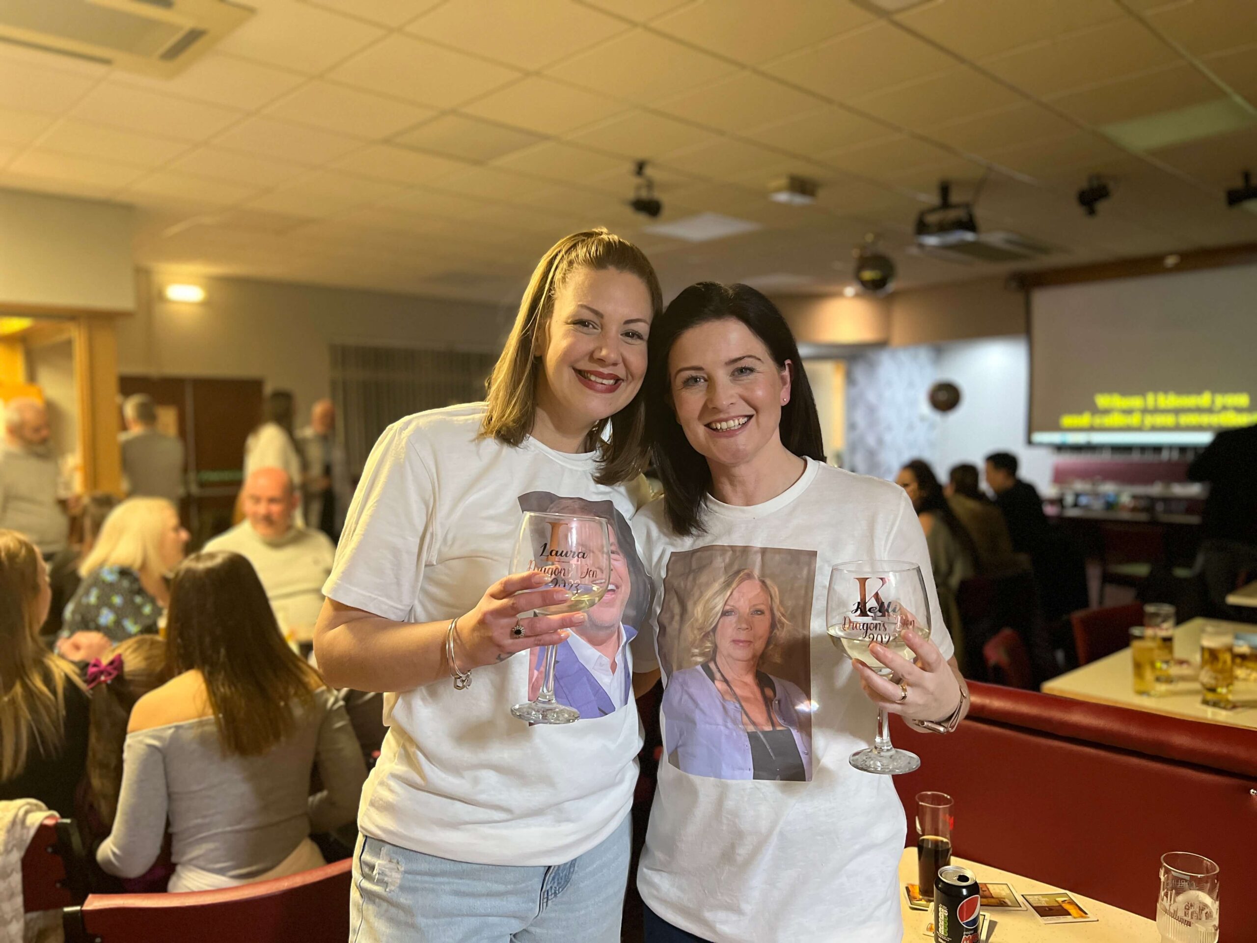Kelli Aspland and Laura Waters wearing t-shirts of their dragon's den investors