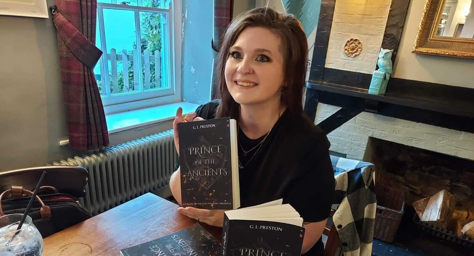 Gemma Seabourne holds a copy of her debut book