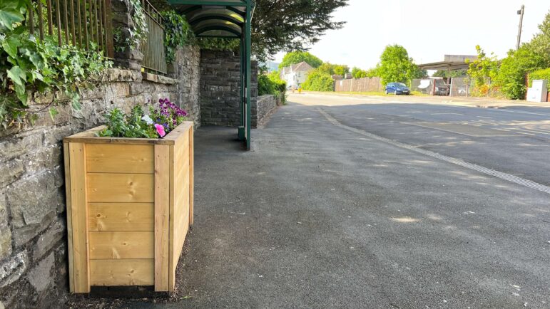 a planter at a bus stop