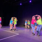 children dance on a stage