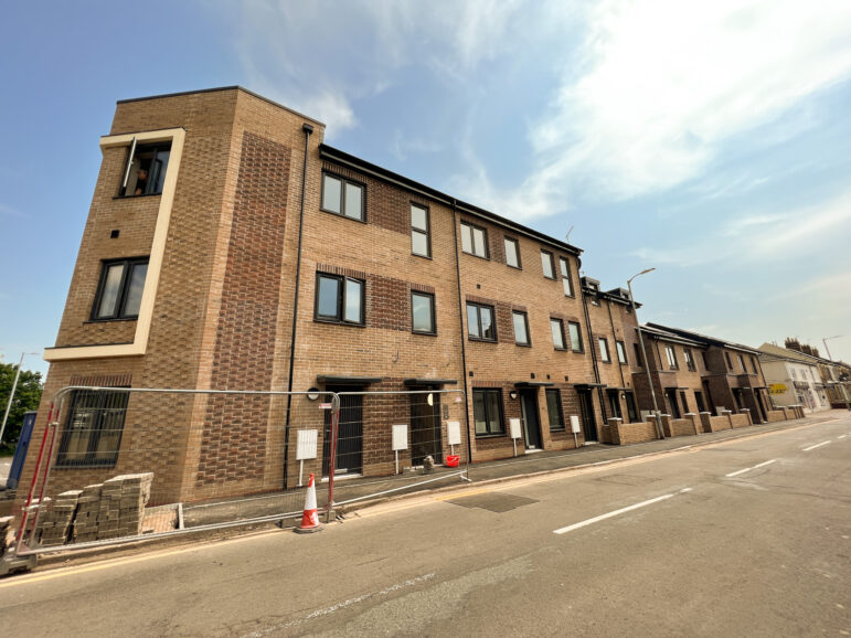 a row of house being built
