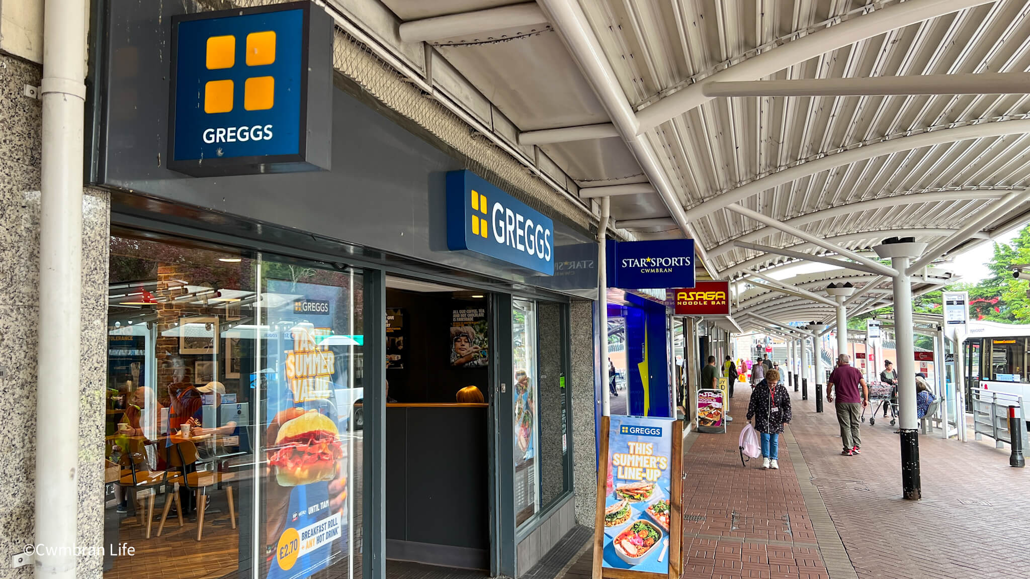 a row of shops including a Greggs