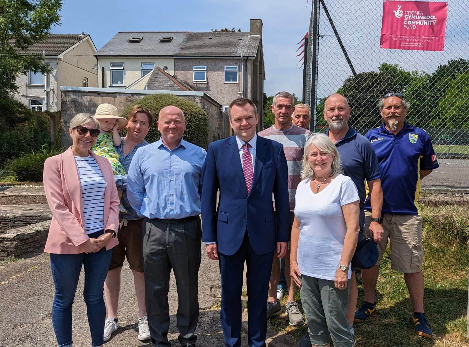 a group of people stood in a park with their local MP