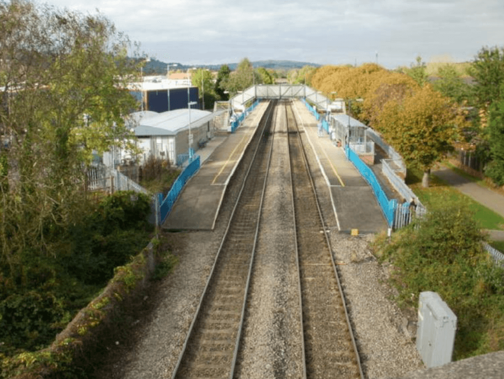 two tracks running through a train station