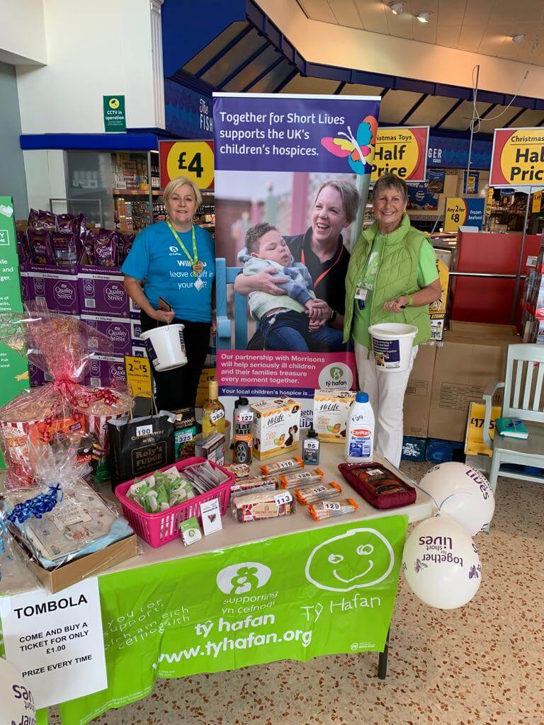 a group of charity volunteers in a supermarket