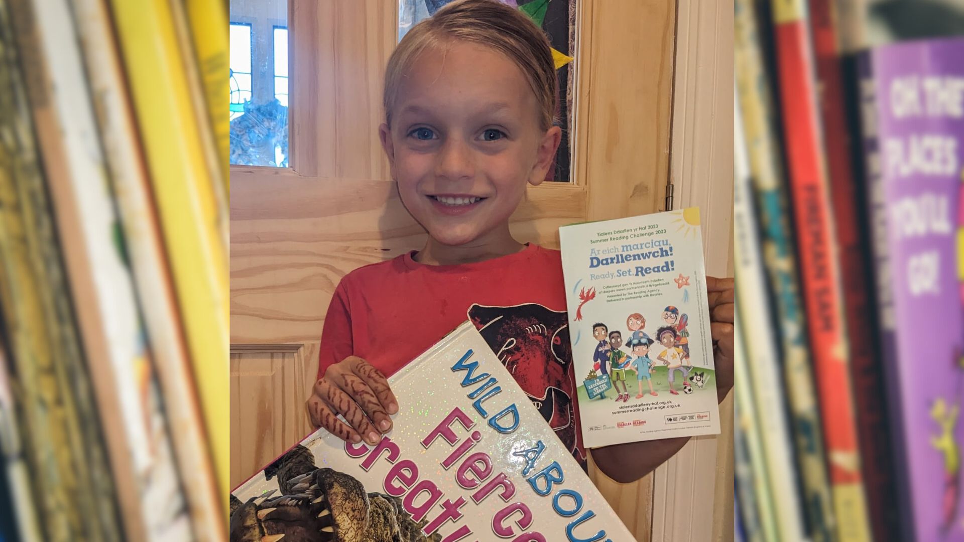 a boy holding books