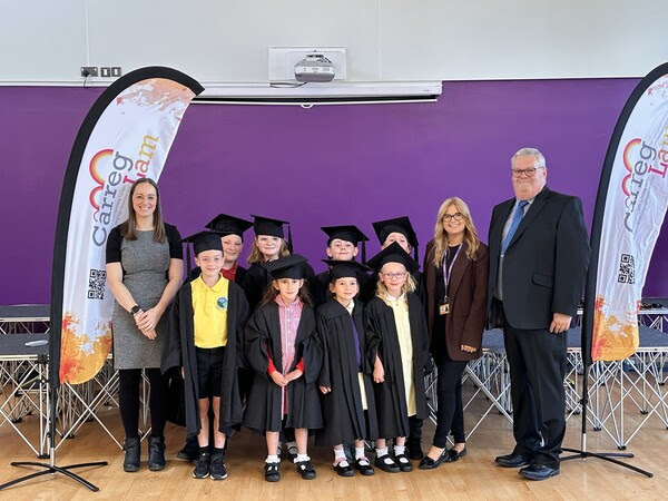 a group of nine children and three adults