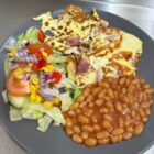 an omelette, beans and sald