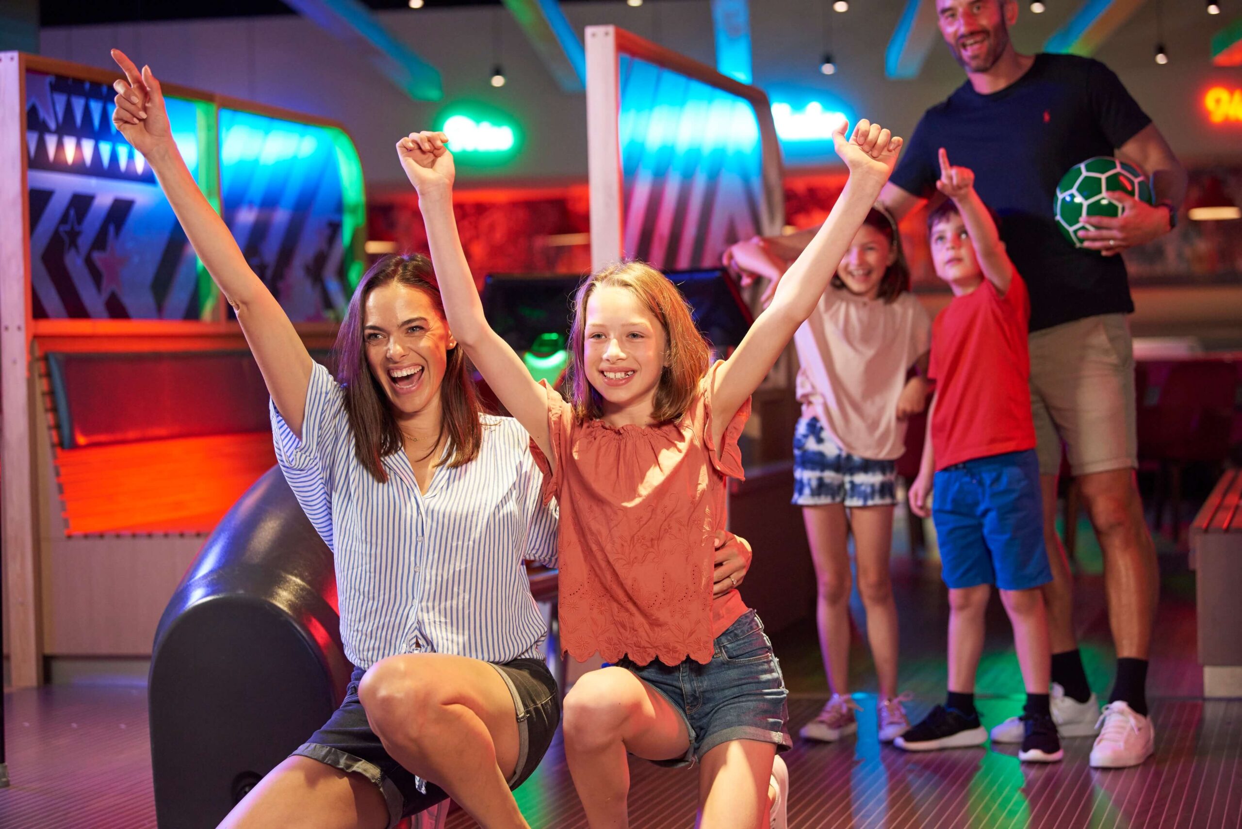 a family at a bowling alley