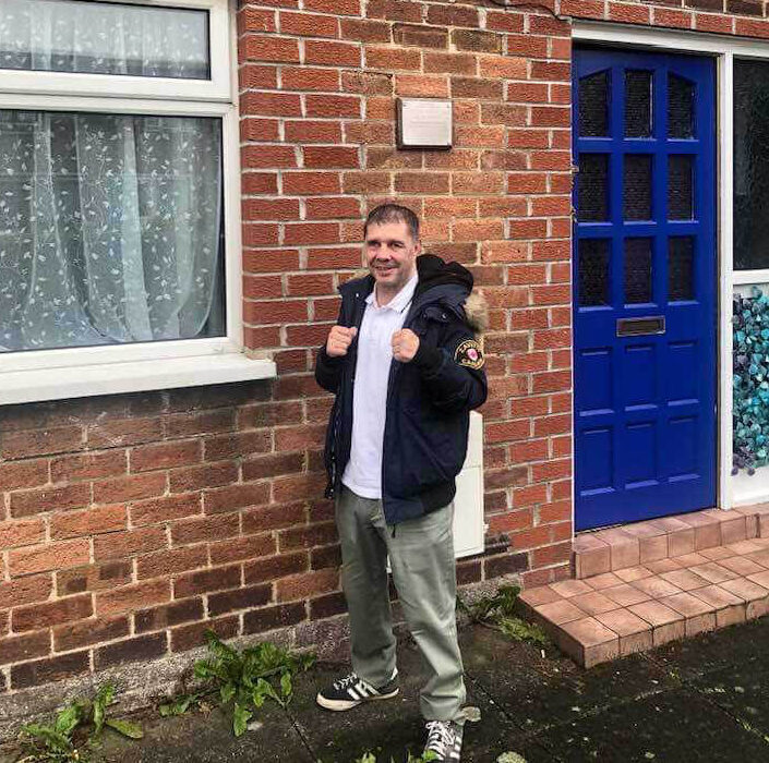 man stood outside house