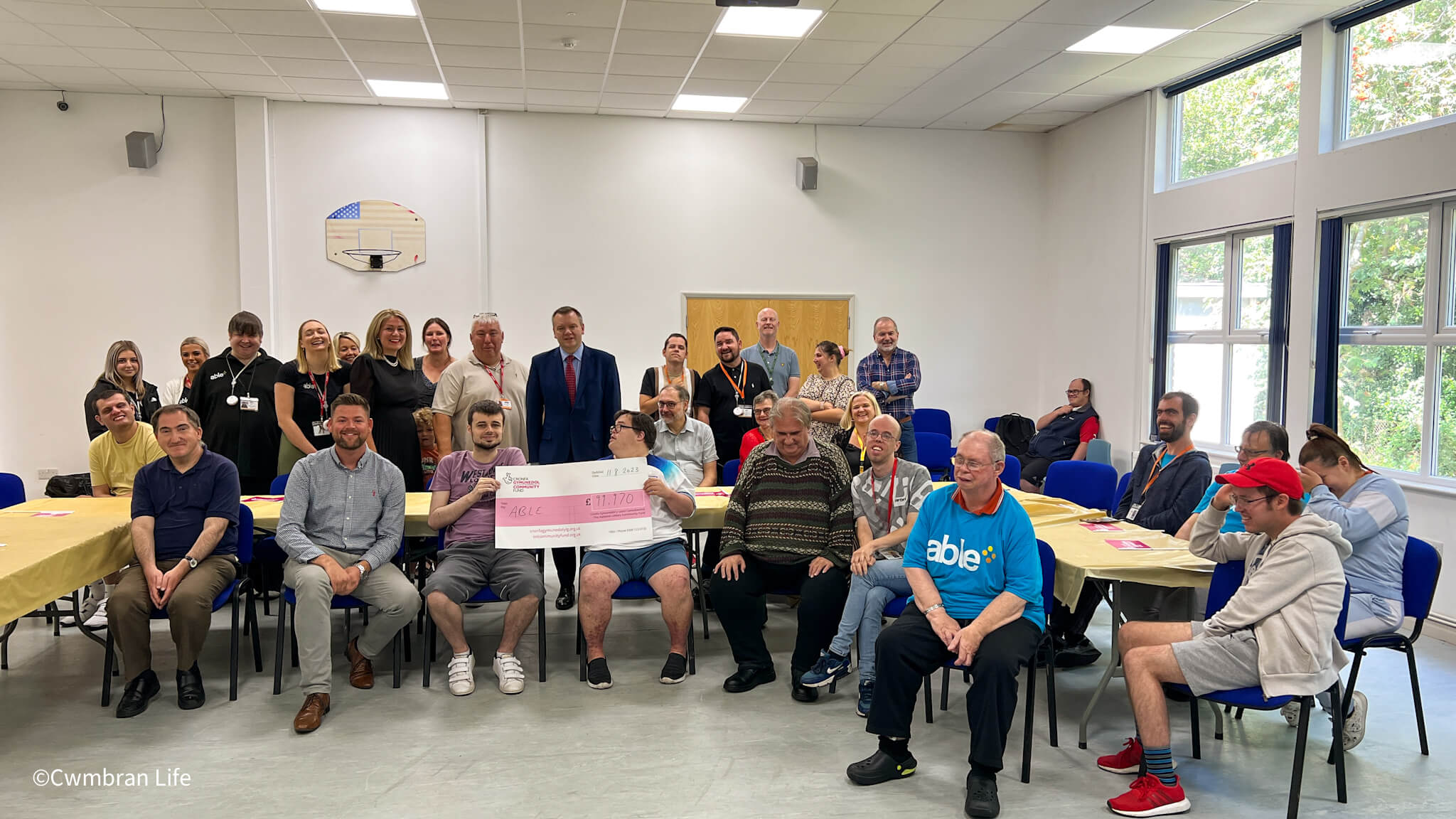 a group of people at a cheque presentation