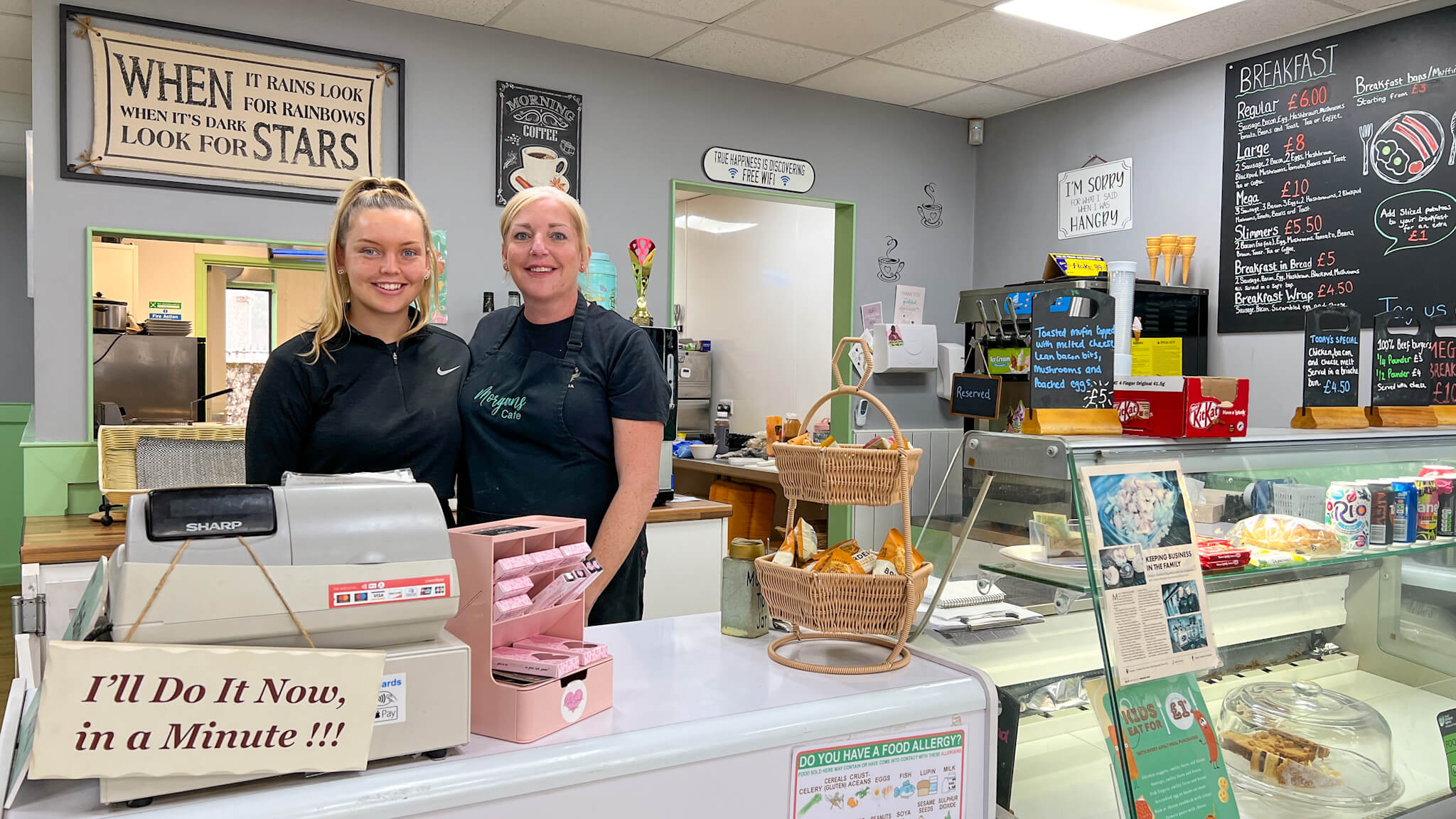 a mum and daughter behind the county at a cafe