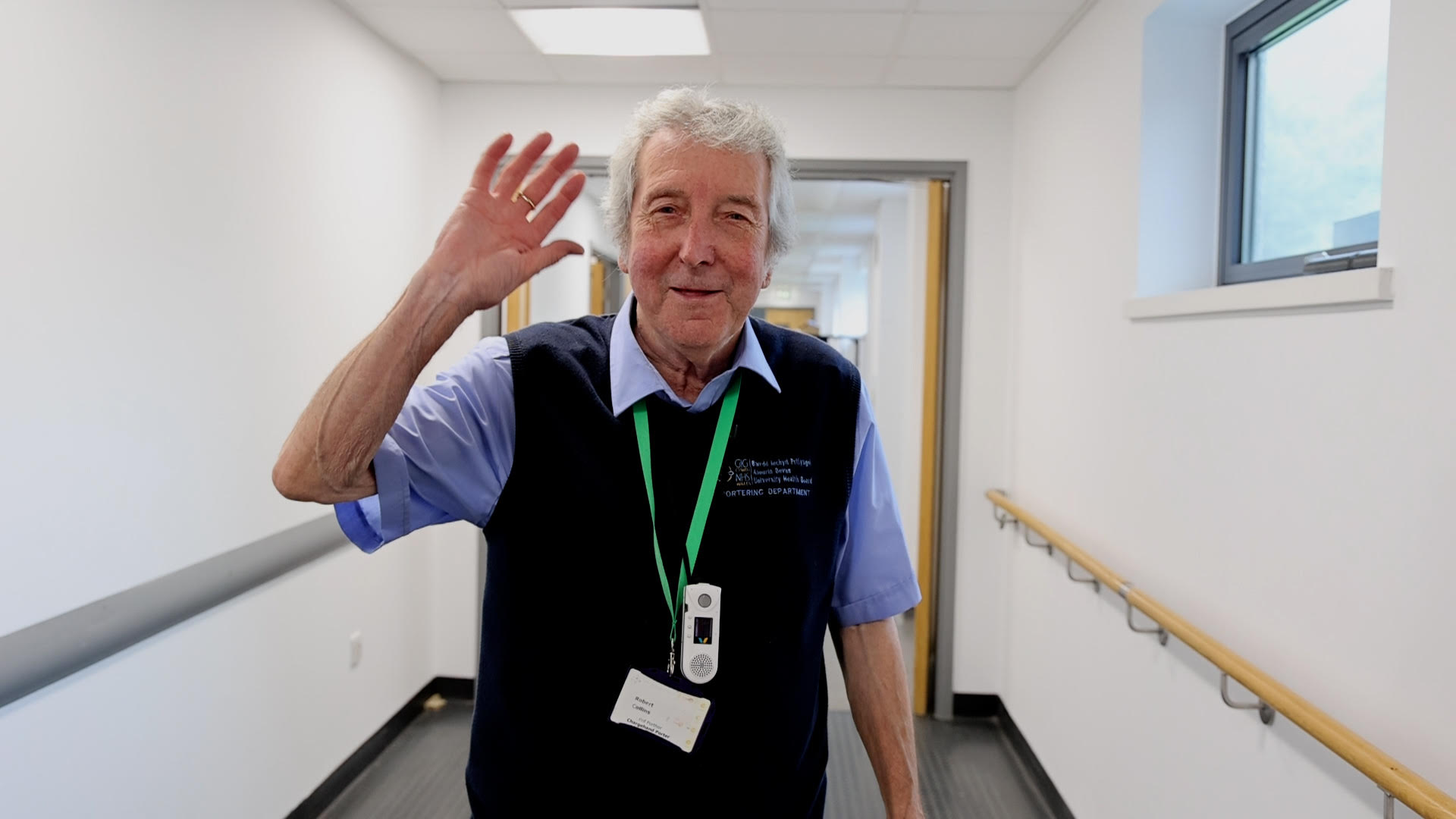 a man waving at camera