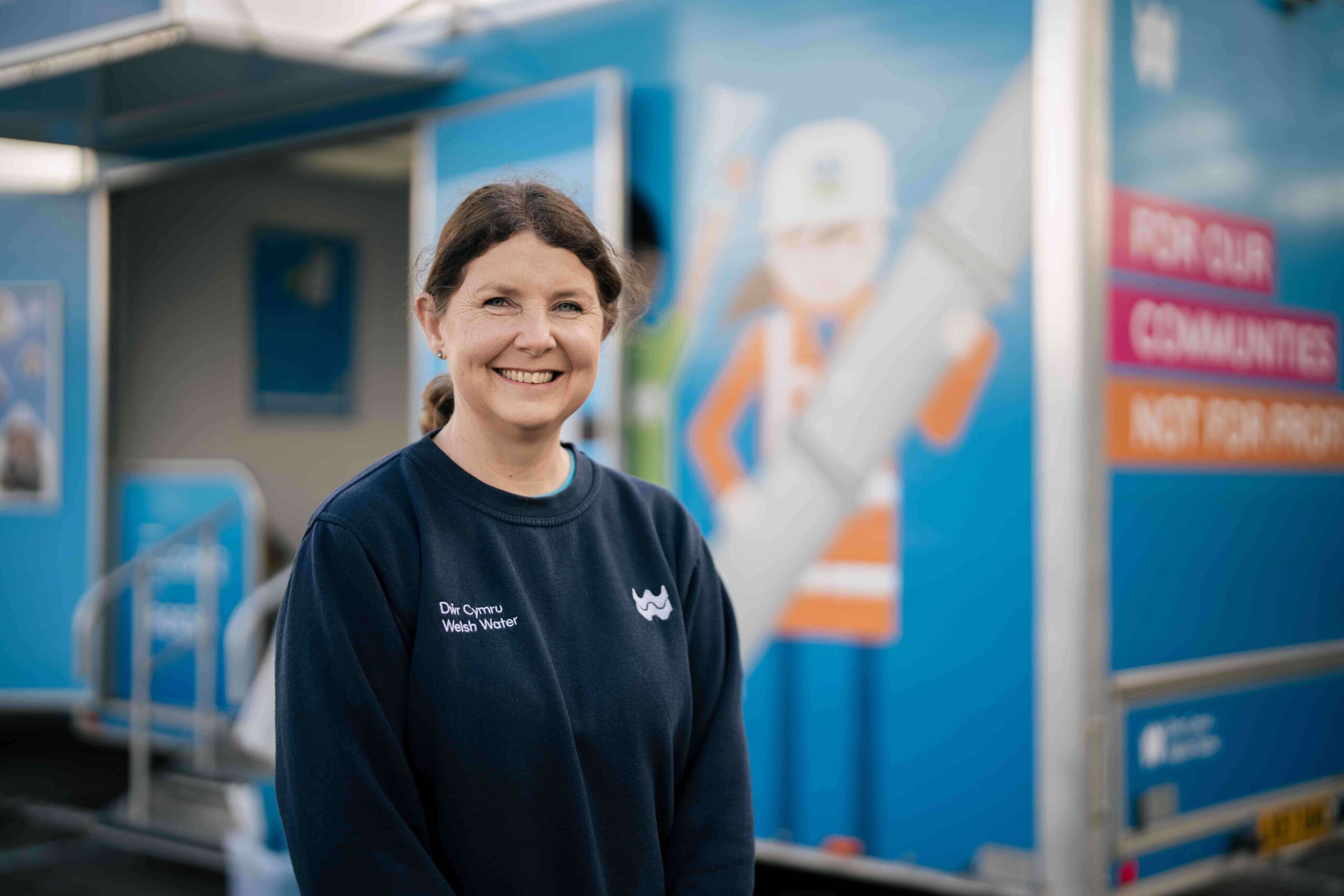 a woman in welsh water branded top