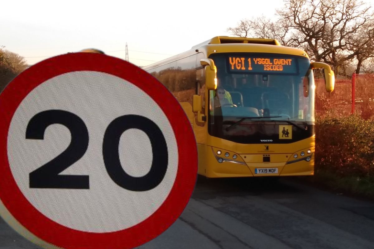 a 20mph sign and a school bus