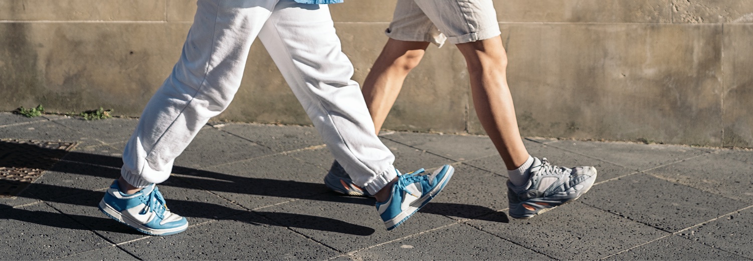 two people walking- you can only see their legs
