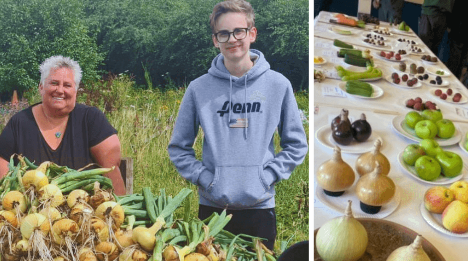 a man and woman stood by vegetables