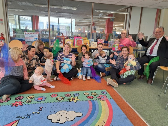 group of chilren and adults in library