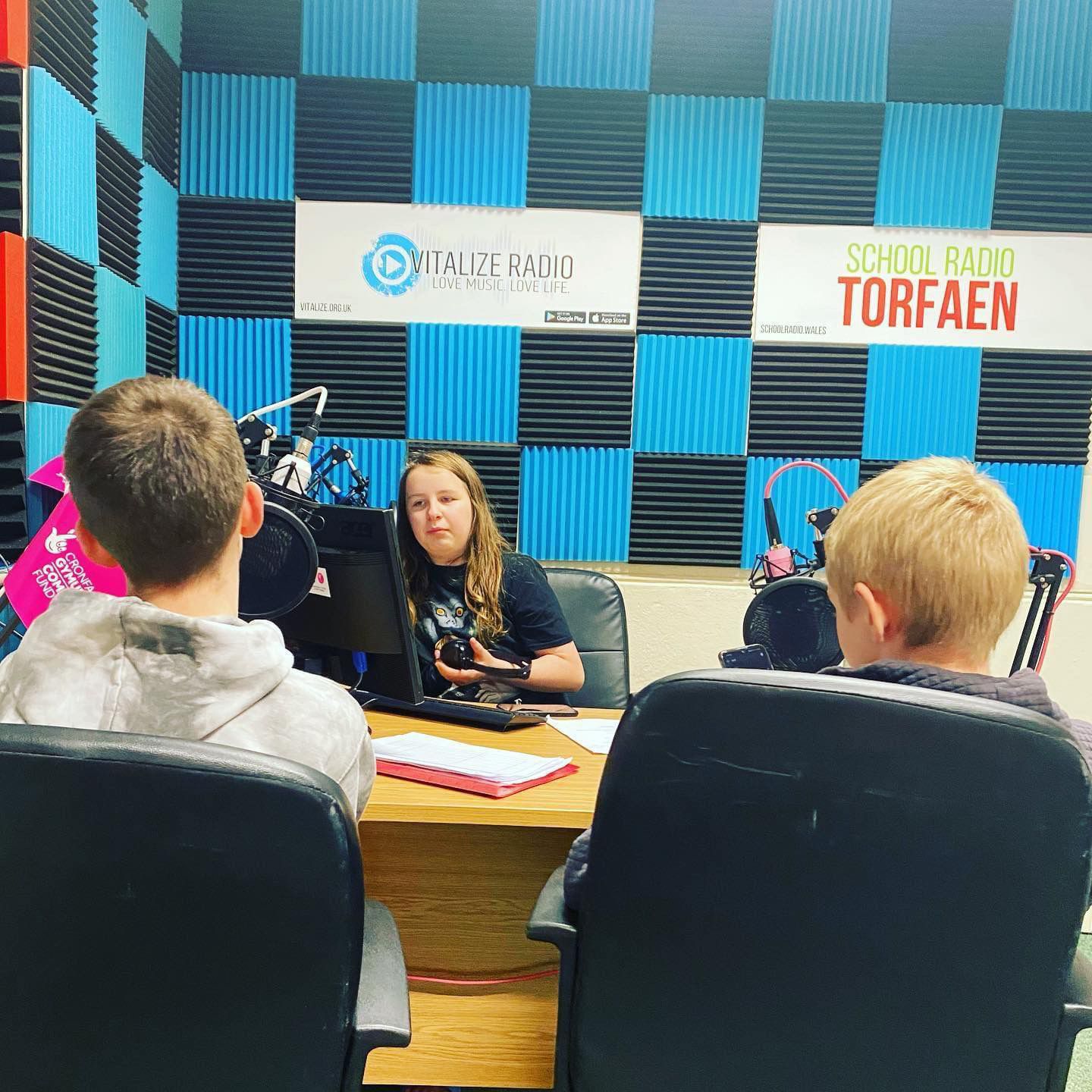 a radio presenter in a studio with