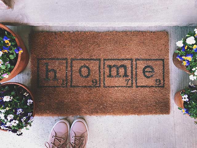 a doormat with the word 'home' on it