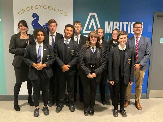 a group of pupils stood with two teachers