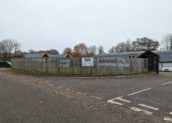 a fence along a road side