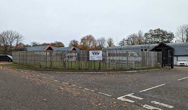 a fence along a road side