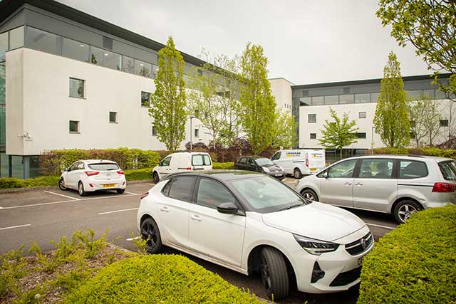 a car park by an office block