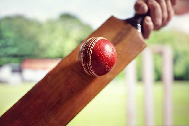 cricket bat hitting a ball