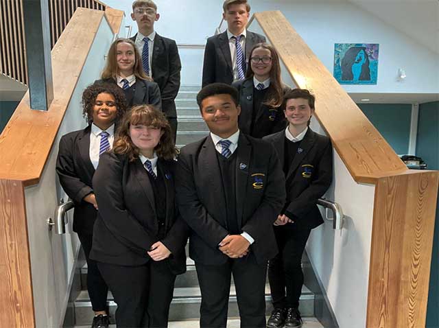 group of pupils stood on stairs