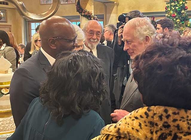 King Charles talking to Sean Wharton and his mum