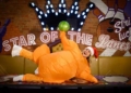 a woman dressed as a turkey in santa hat