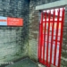 red gates to a royal mail collection office