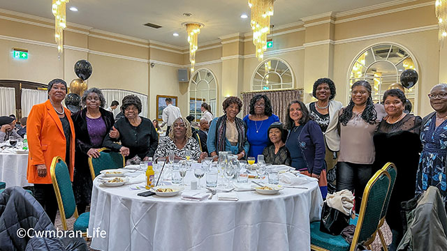 a group of women stood around a table