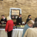 pupils serving dinner in a community hall