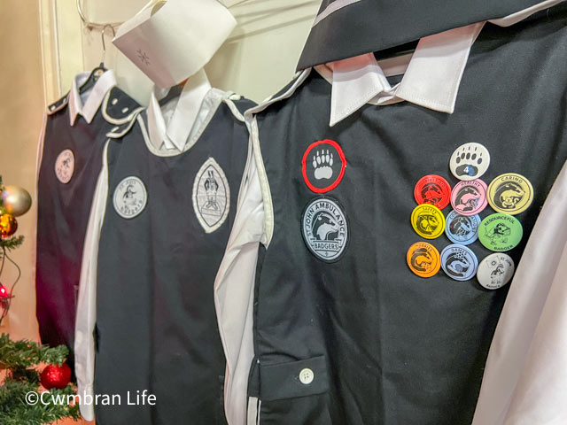 three old st john ambulance uniforms on display