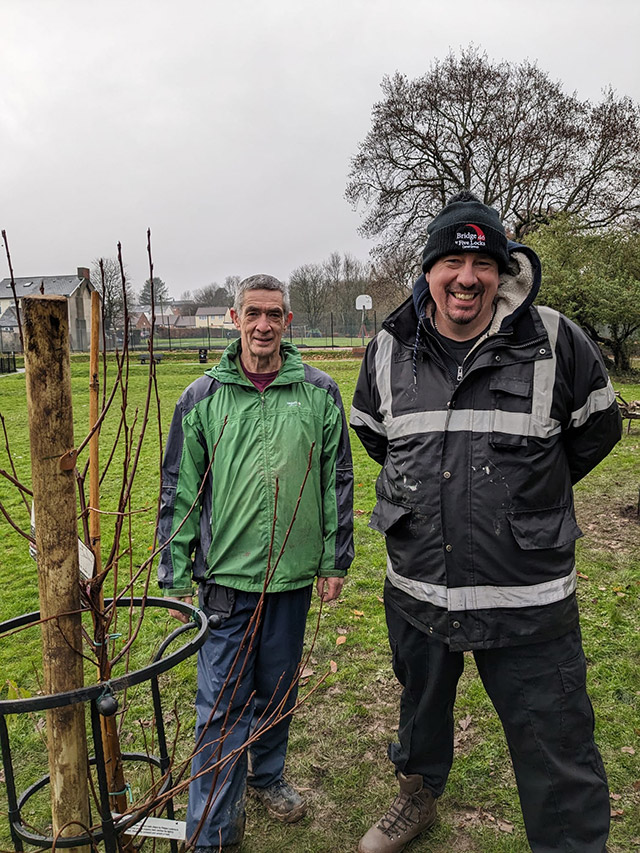 two men by a cherry tree