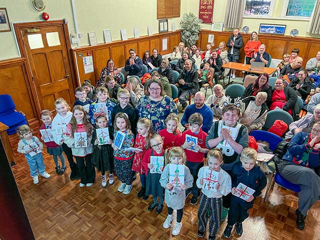 a large group of children and parents