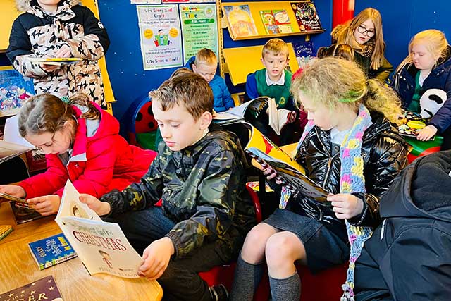 group of children reading books