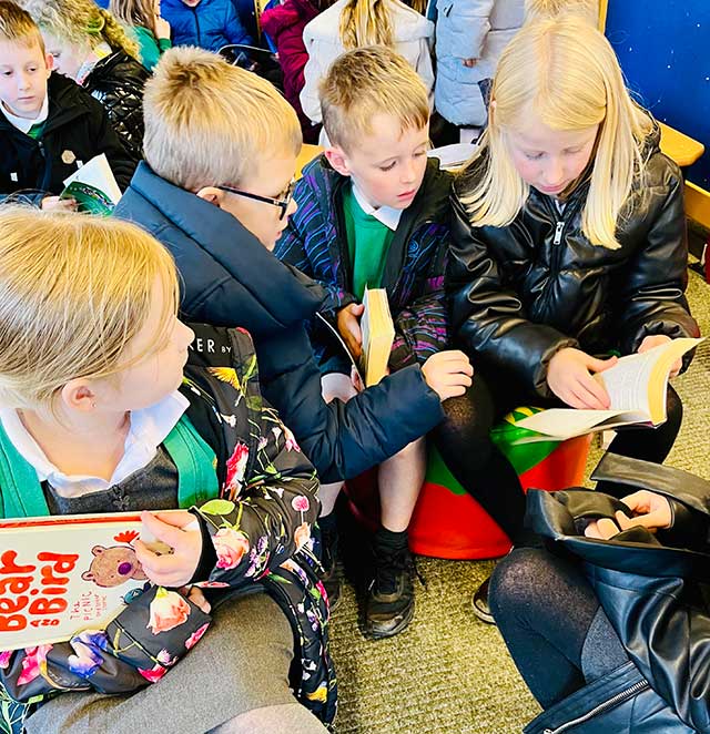 group of children reading books