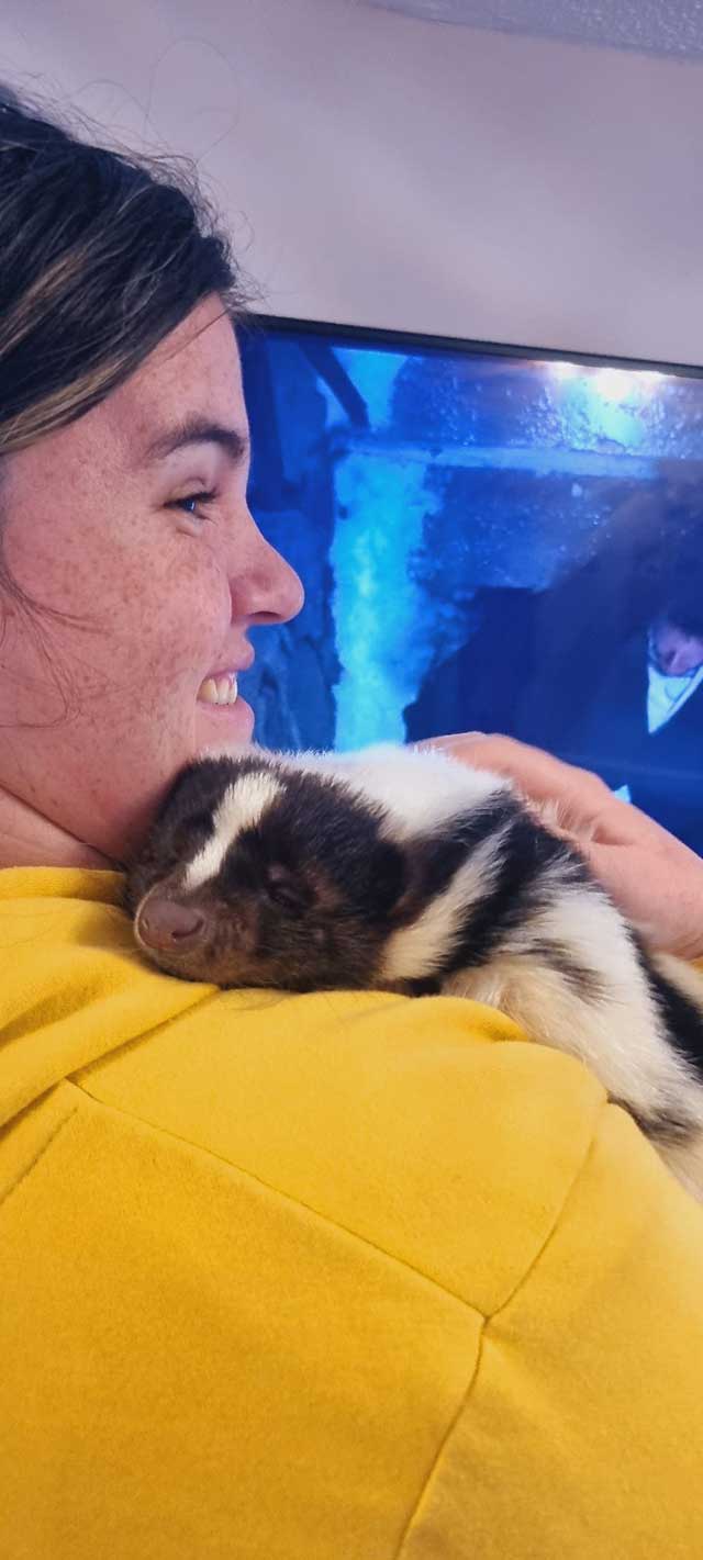 woman with animal on shoulder