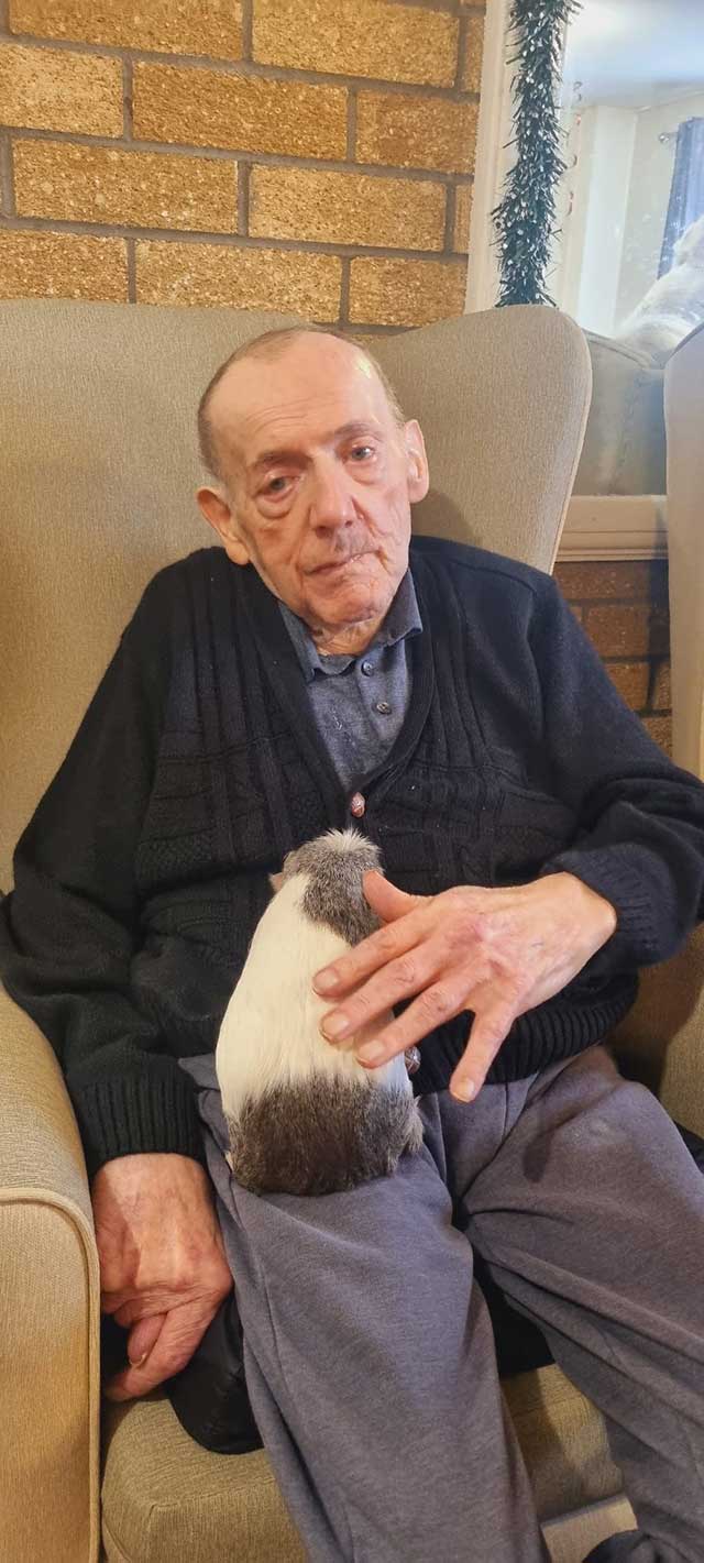 a man with a guinea pig